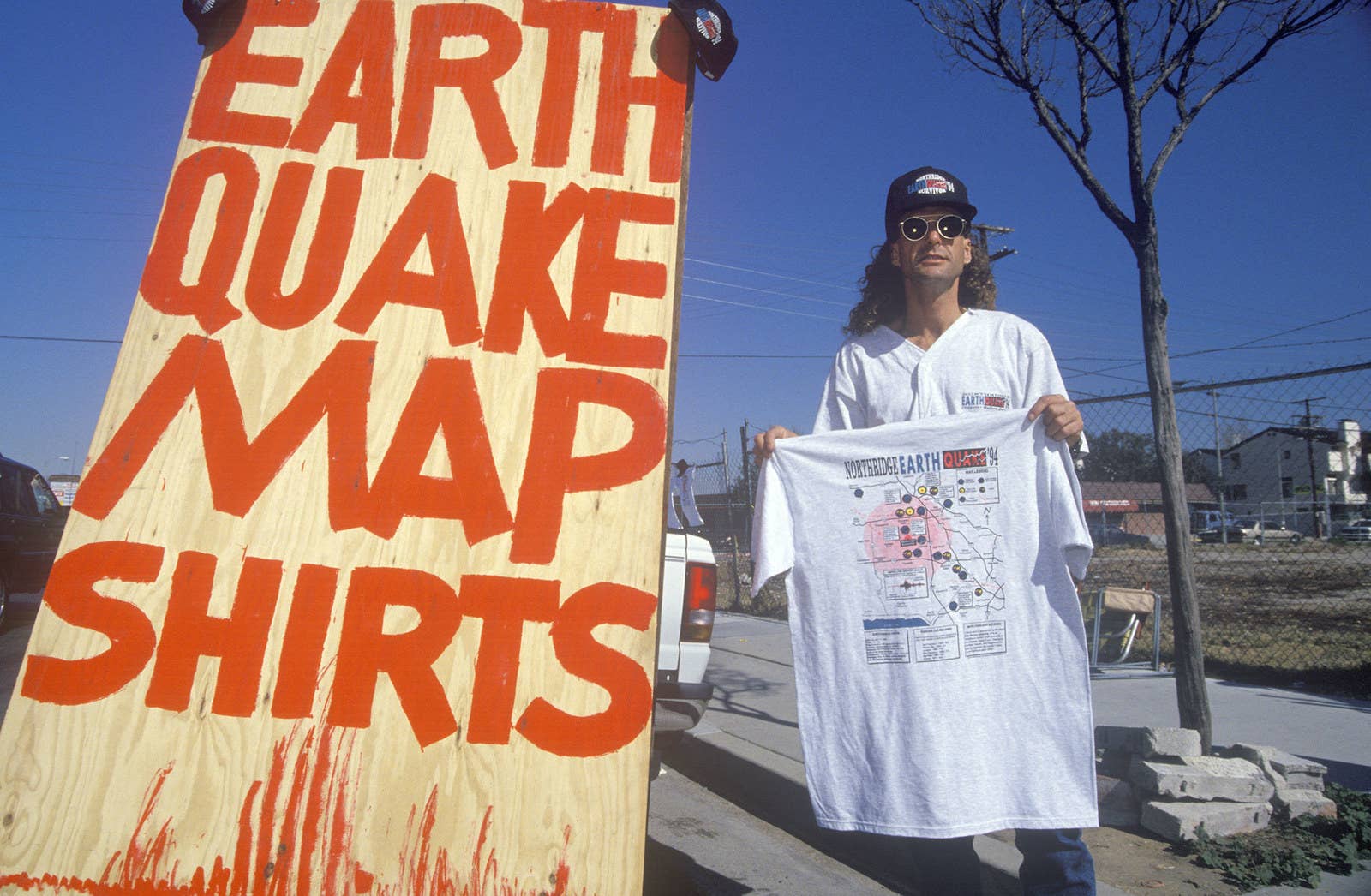 Joe Sohm / Getty Images A man sells T-shirts with a map of the quake in 1994.