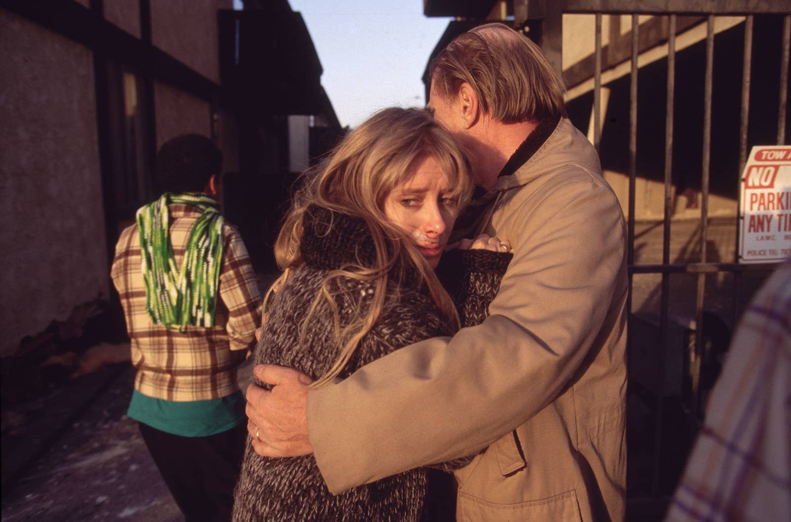 David Butow / Getty Images People embrace in the aftermath of the earthquake on Jan. 17.