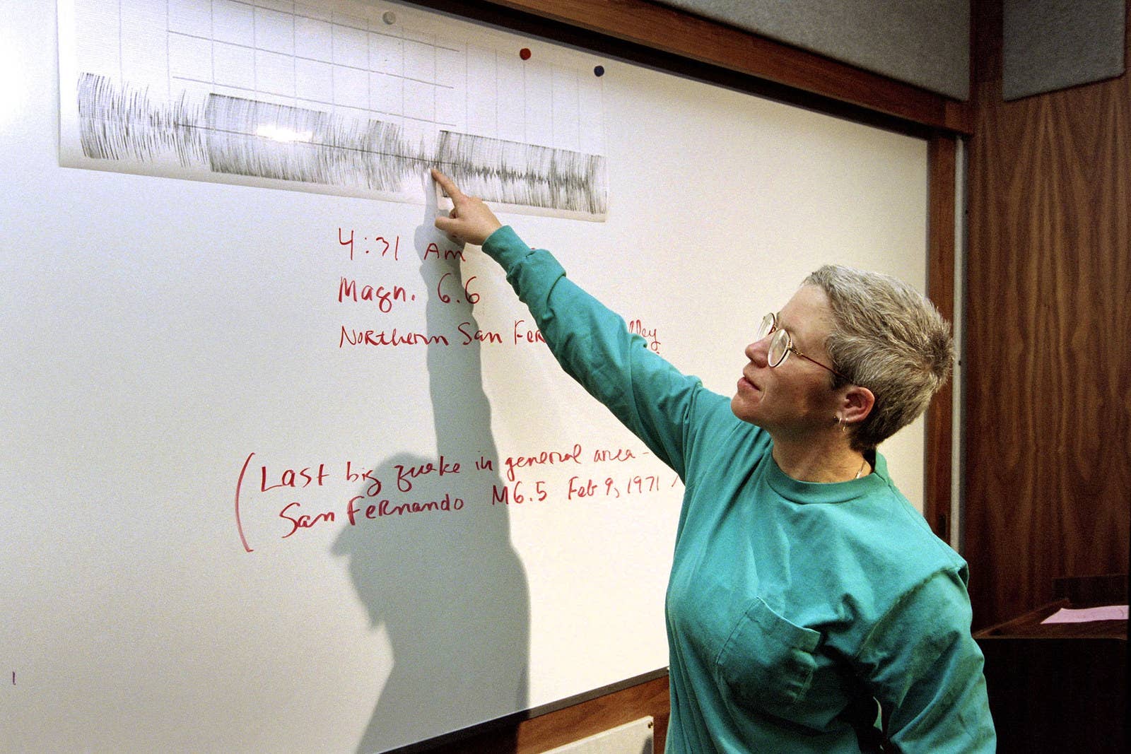 Afp / AFP / Getty Images California Institute of Technology seismologist Kate Hutton uses a graph to point out to the press the starting point of the earthquake on Jan. 17.