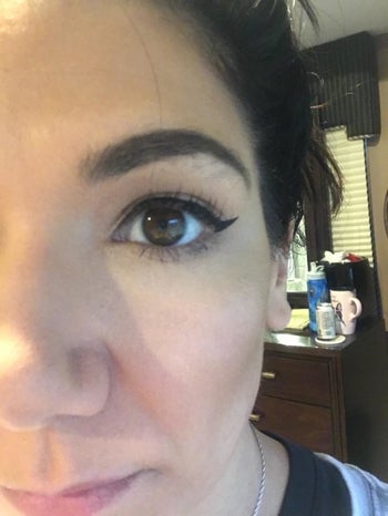 reviewer shows her winged eyeliner look