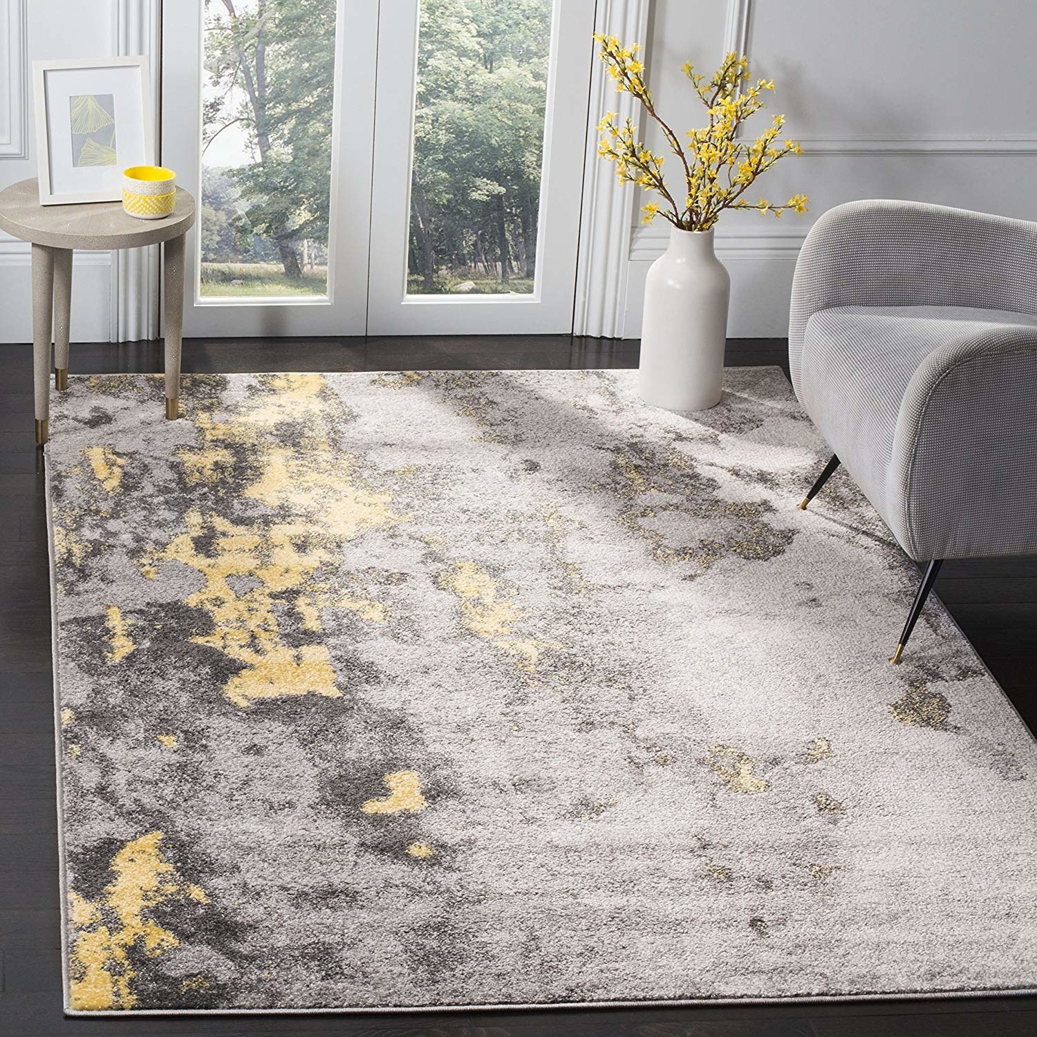 a gray rug with gold throughout 