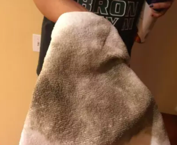 cloth that cleaned the bannister covered in dust