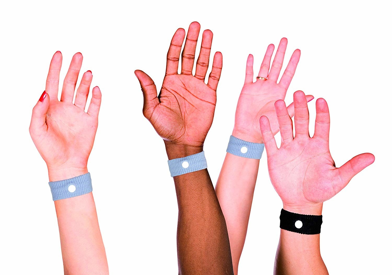 hands with bracelets with white circles 