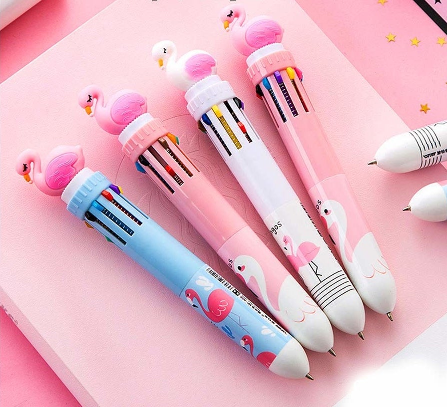 Four thick pens with little flamingos at the top
