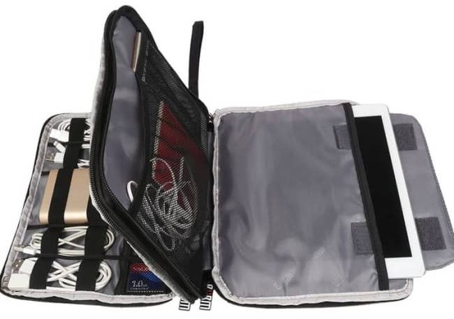 the travel pouch with a middle section and multiple pockets