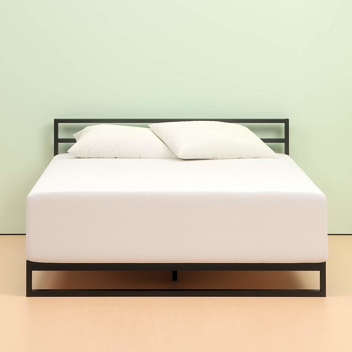 thick white mattress on a bed frame