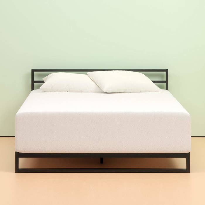 thick white mattress on a bed frame
