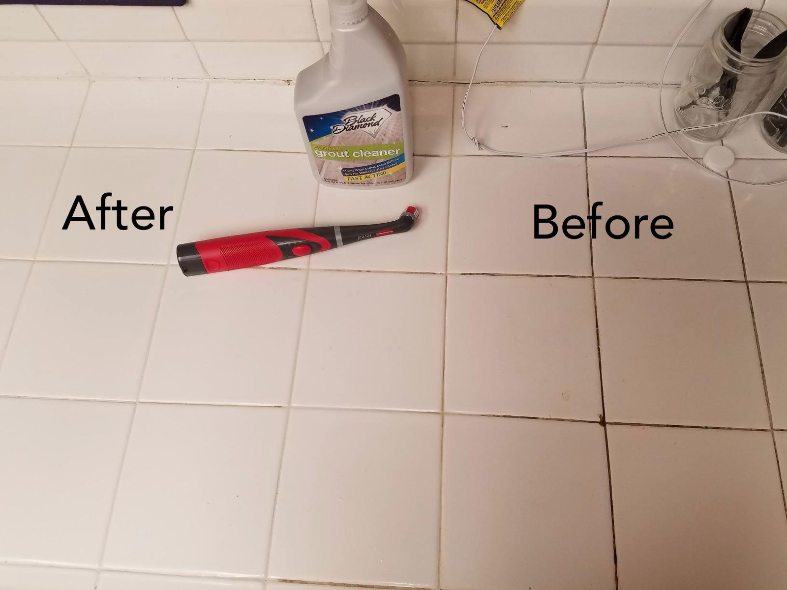 A review image of the scrubber on a half-cleaned surface, with dark, dirty grout before and clean grout after