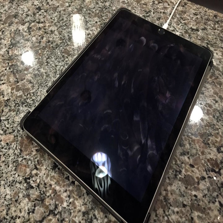 An iPad covered in fingerprints and smears
