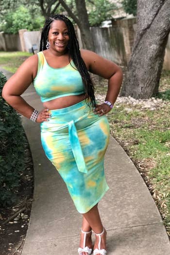 reviewer in green yellow and blue tie dye tank and bodycon midi skirt set