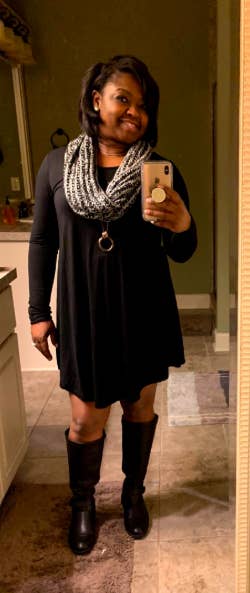 A reviewer wearing the above-the-knee dress in black