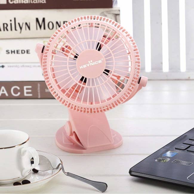 a pink small desk fan