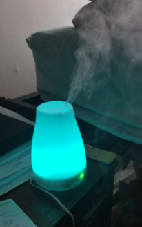 a reviewer photo of the diffuser glowing blue
