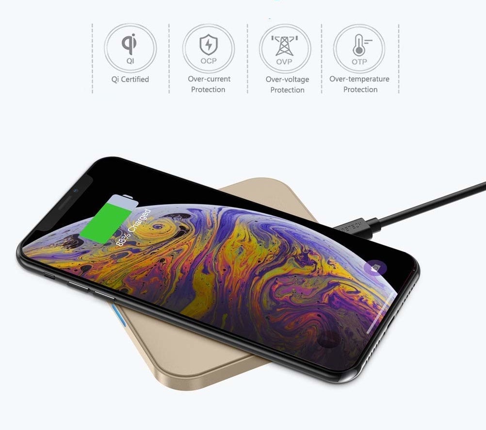 A phone charges on the charging pad