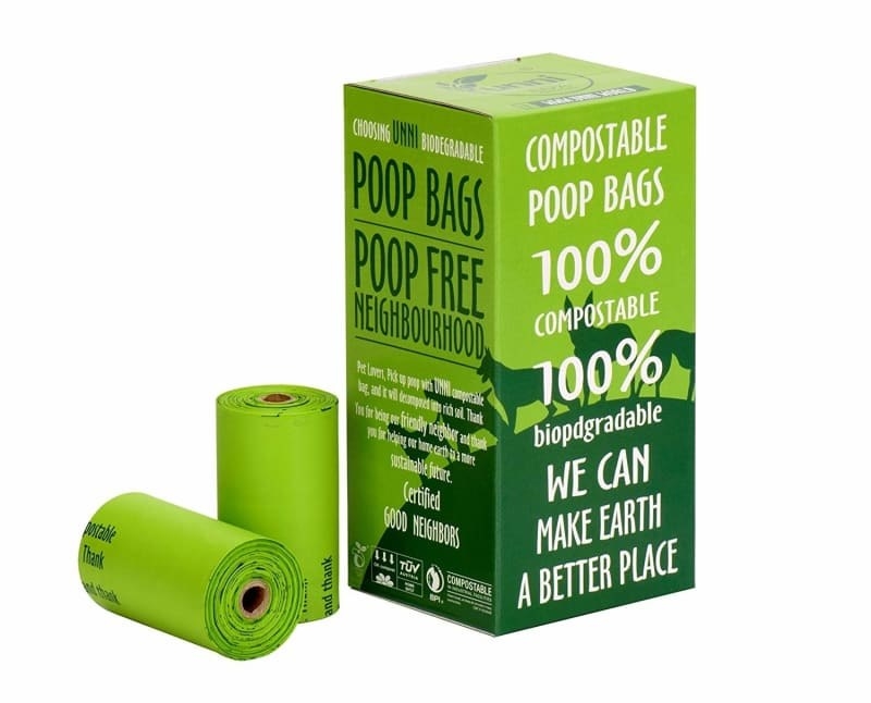 Two bright green rolls of bags next to the box