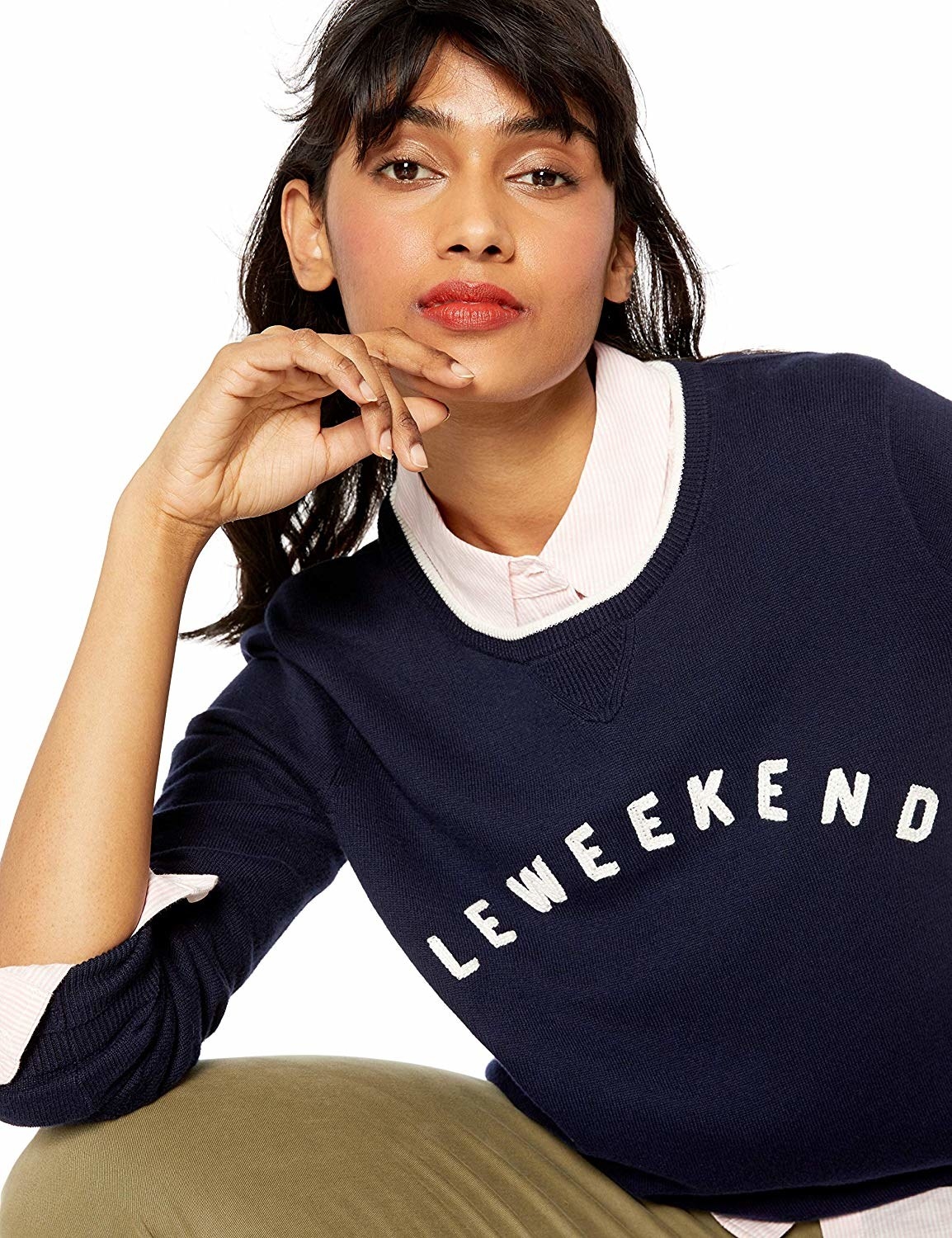 A model wearing the cotton sweatshirt that reads "Le Weekend."