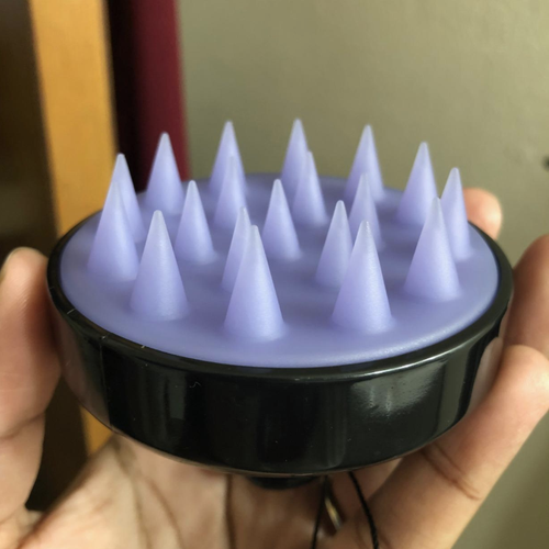 the black Heeta Scalp Care Hair Brush