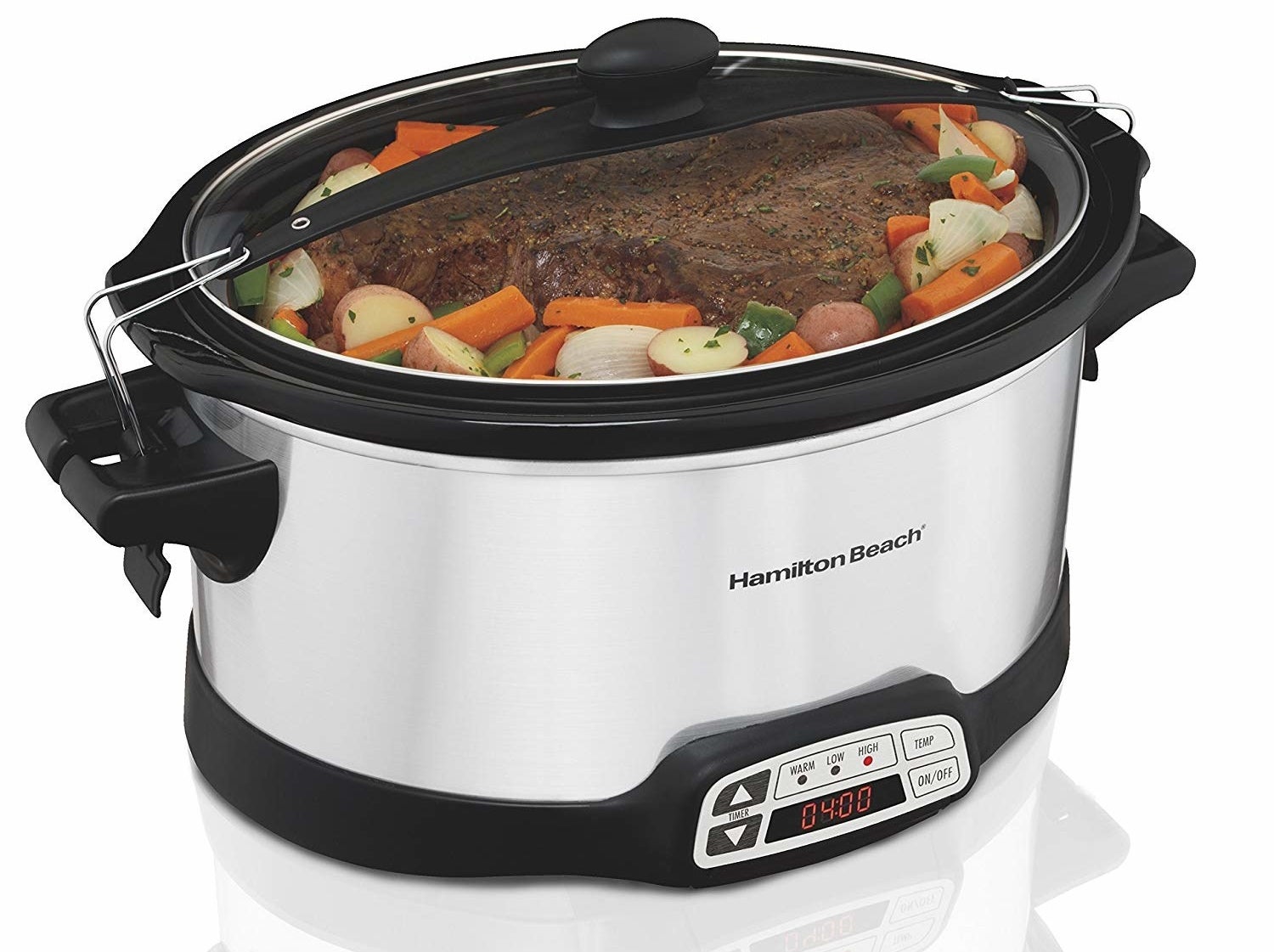 The stainless steel slow cooker with meat and veggies inside