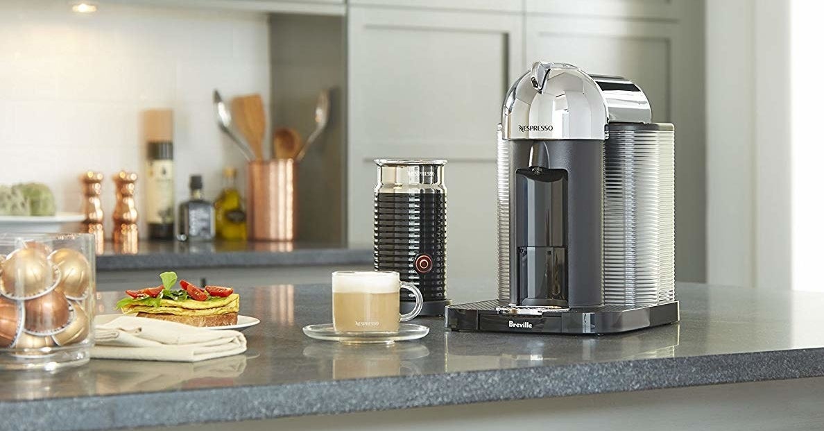 The espresso machine and milk frother on a counter