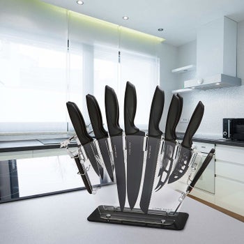 A transparent acrylic block with the knives sticking inside