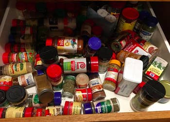 Reviewer's before picture of messy spice drawer