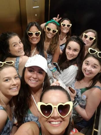 a group of girls in yellow heart-shaped sunglasses