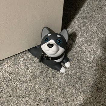 reviewer's doorstop that looks like a black and white husky