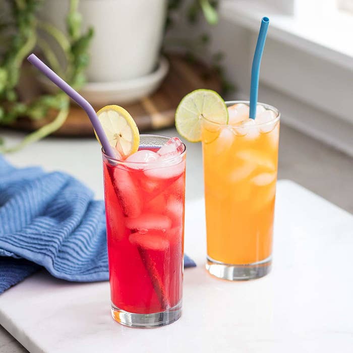 the straws being used with two drinks in glass cups