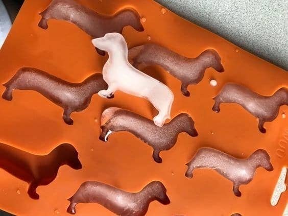 the tray in use displaying dachshund-shaped ice cubes