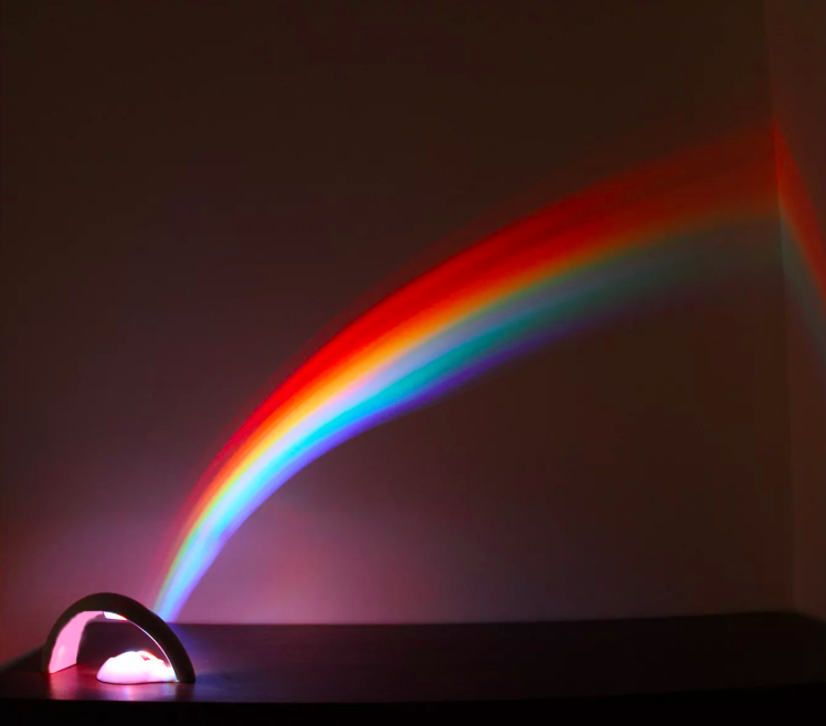 the rainbow light in use in a dark room