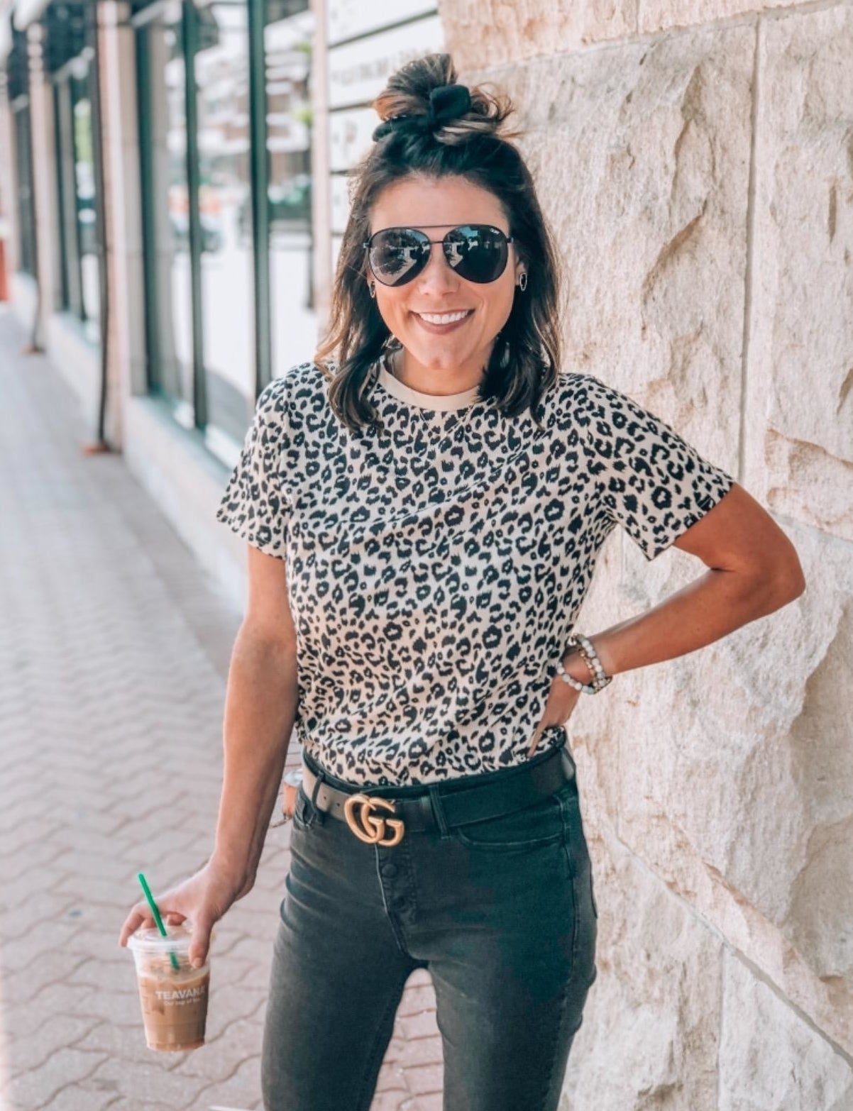 Reviewer wearing the t-shirt tucked into black jeans with a belt