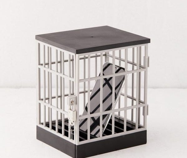 a phone inside a small cage