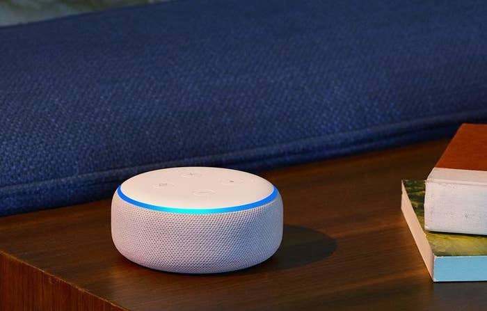 a white echo dot on a side table