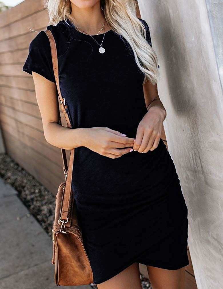 A model wearing the dress in black