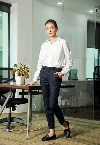 model wearing trousers in office setting