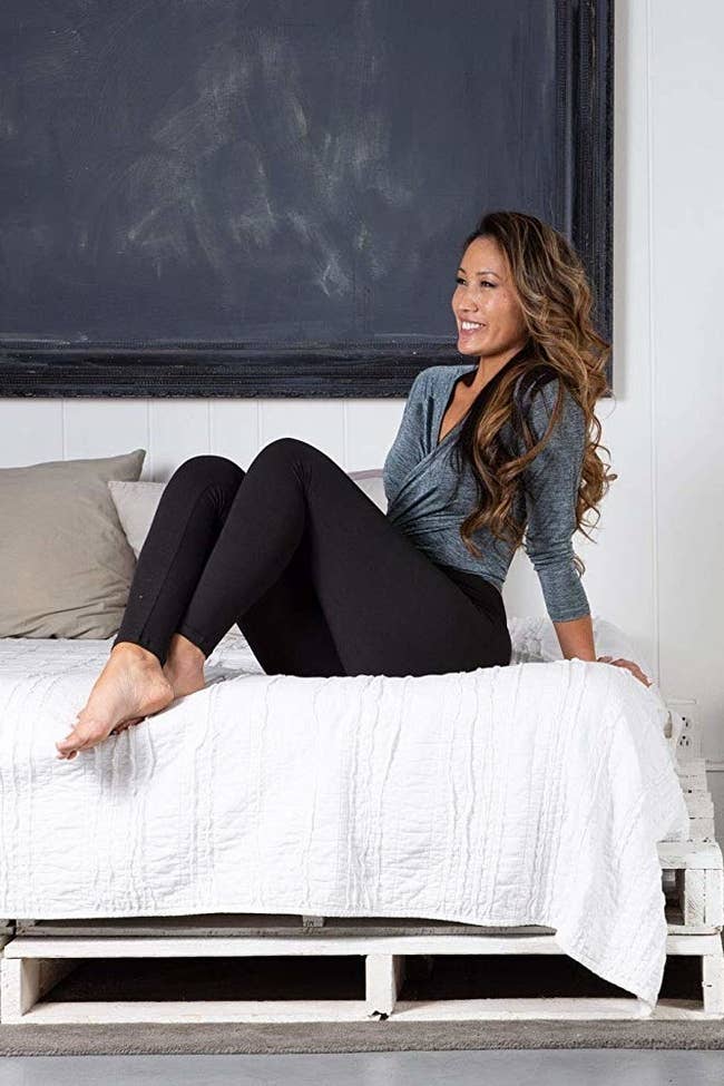 different idiosyncratic wearing the leggings sitting connected a bed