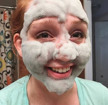 reviewer with the bubble mask on their face
