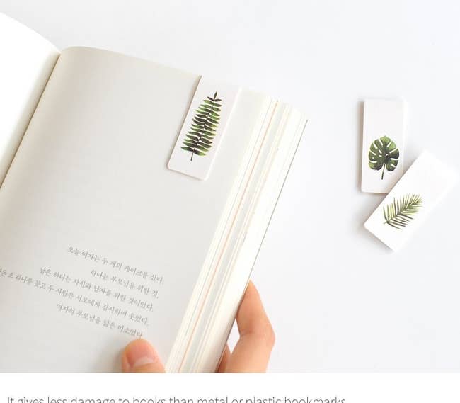 magnetic bookmark with leaf on it in a book