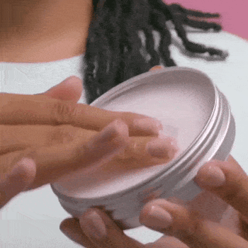 Gif of model washing makeup away with cleanser