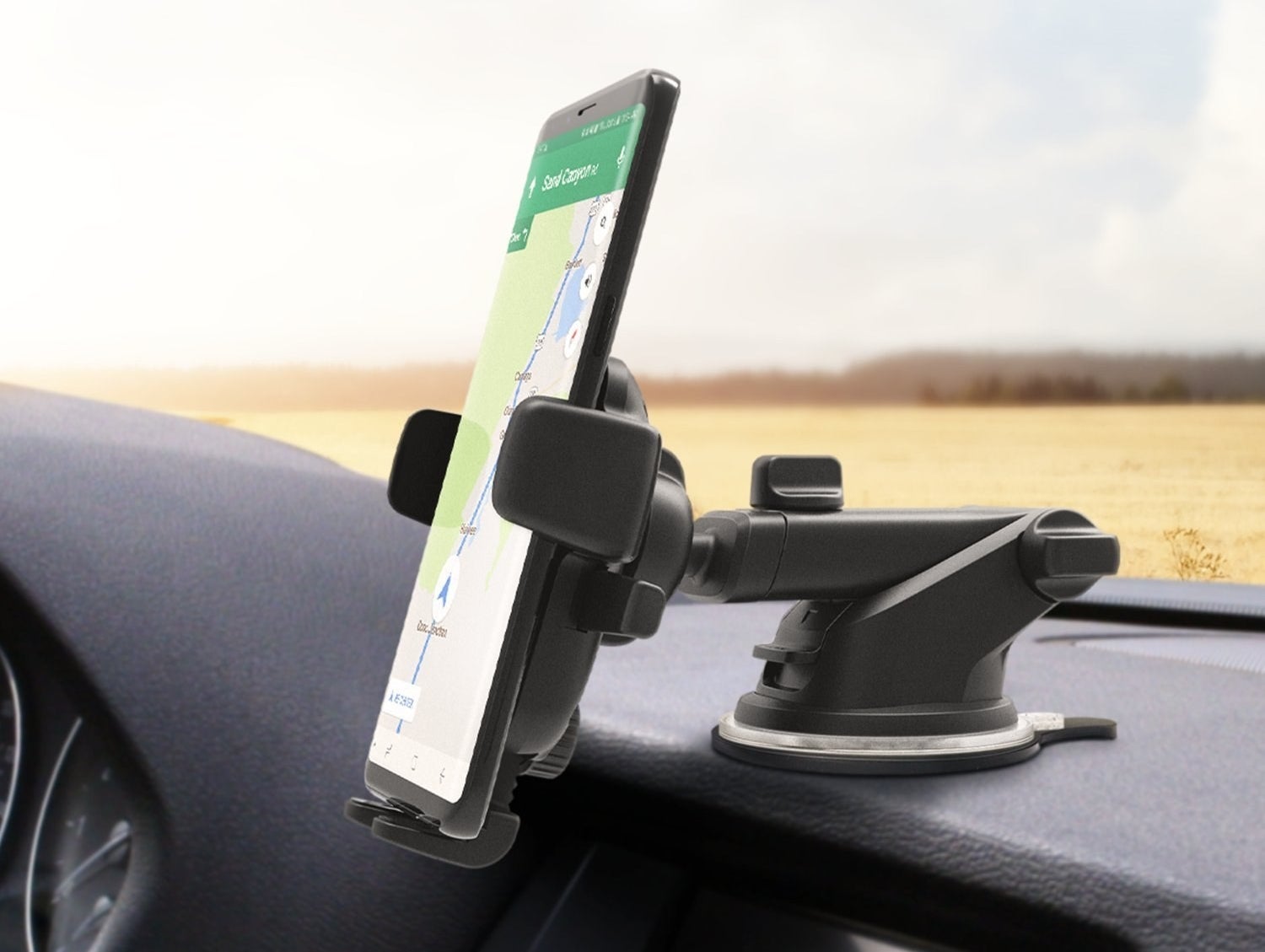 the holder mounted to a dashboard holding a smart phone
