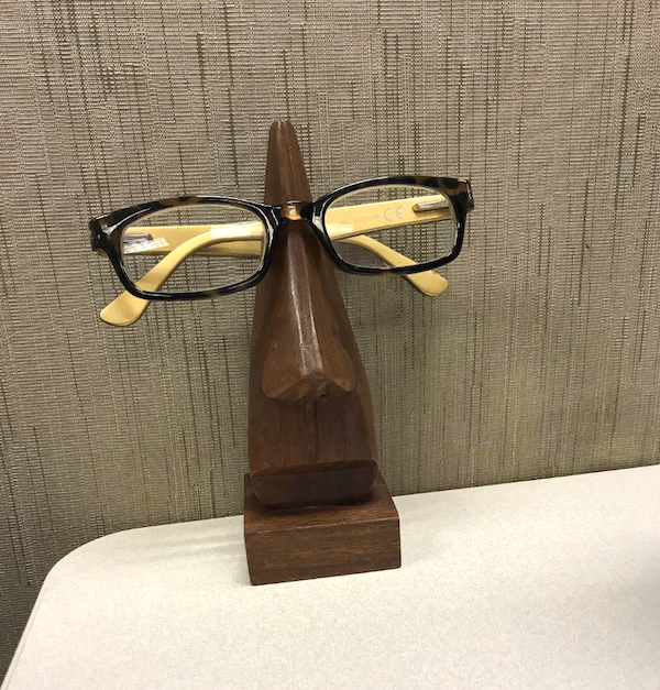 Glasses resting on the eyeglass holder