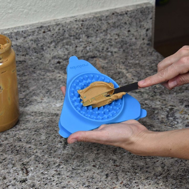 Peanut butter on treat dispenser 