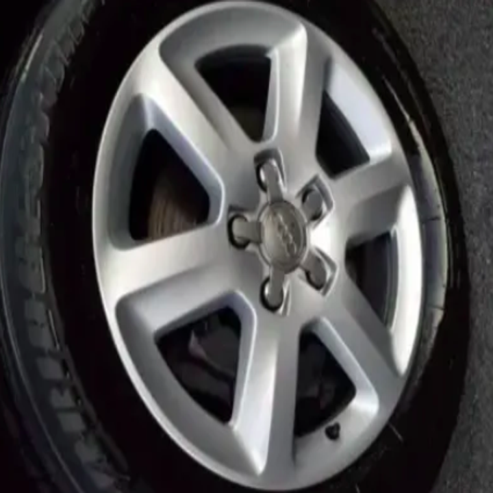 the same tire's metal now looking shiny and new