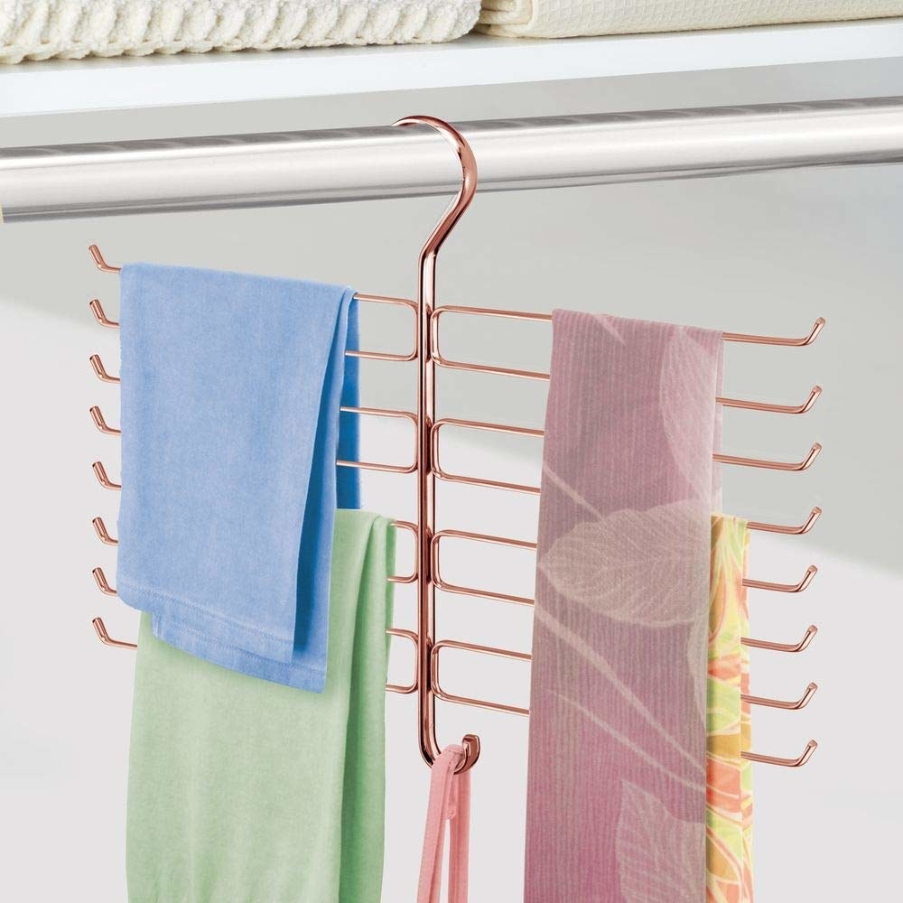 rose gold coat hanger-like scarf organizer with horiztonal arms to slip on the scarves