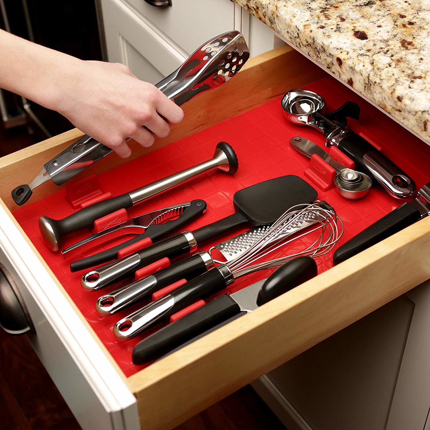 open kitchen drawer with red silicone organizer in it with movable organizer parts to change up design with your needs