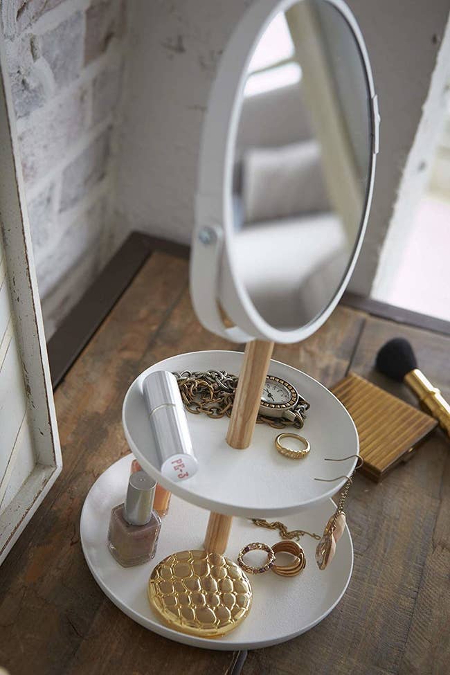 vanity mirror with two stacked trinket dishes 