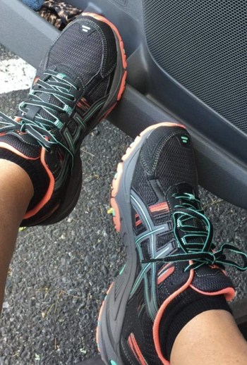 Reviewer wearing Asics Gel Venture sneakers
