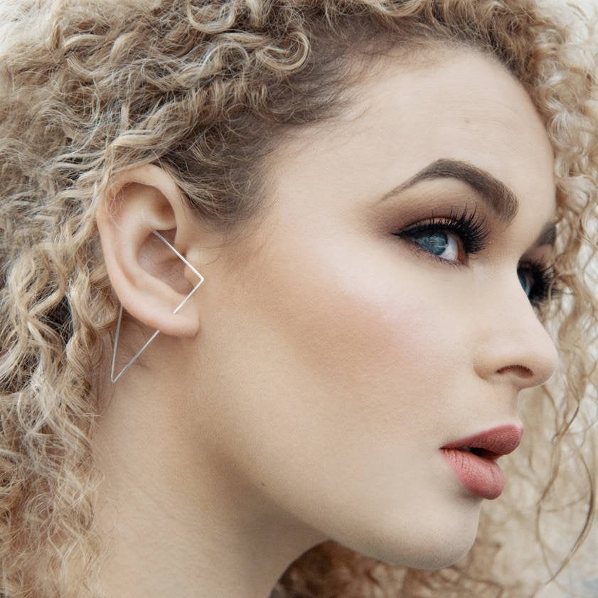 model wearing a triangular cuff earring