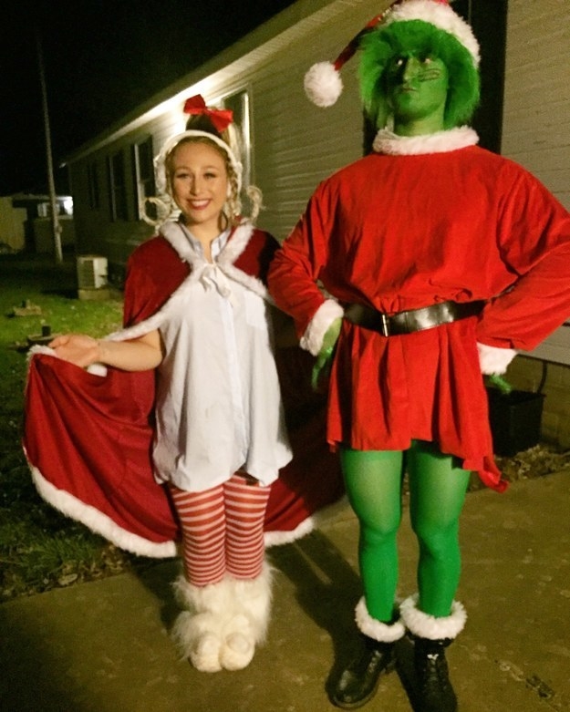 Two people dressed as the Grinch and Cindy Lou