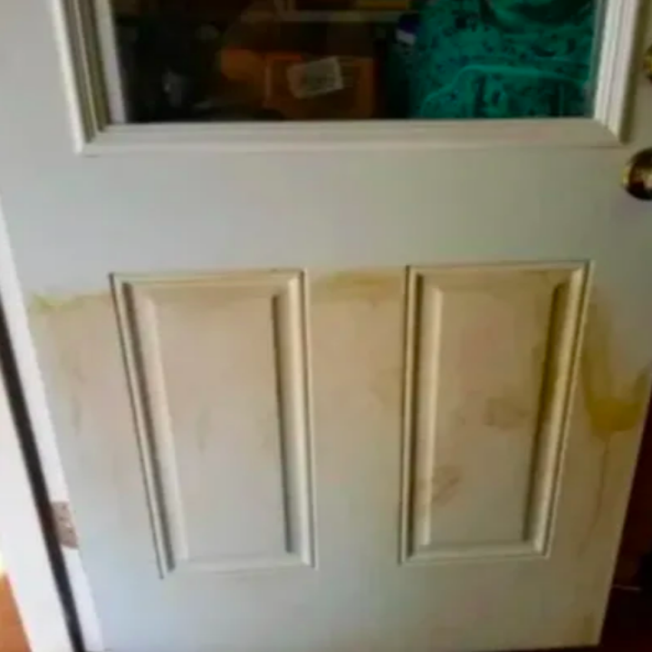 A customer review photo of their door before using the pads